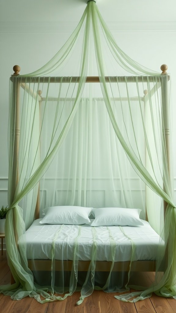 A cozy sage green canopy bed with sheer drapery and white pillows